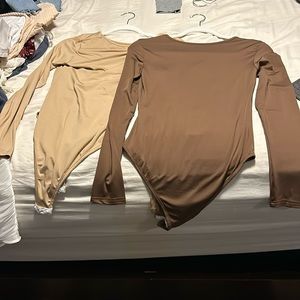 Light brown and dark brown body suits